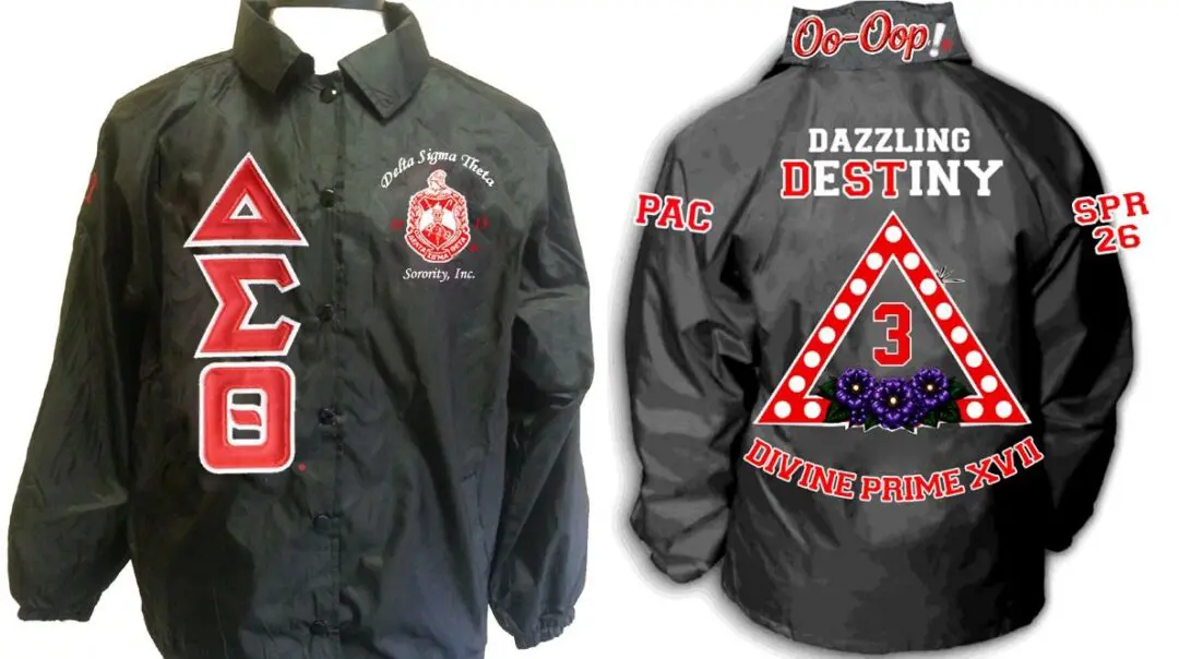 Black fraternity jacket with red Greek letters.